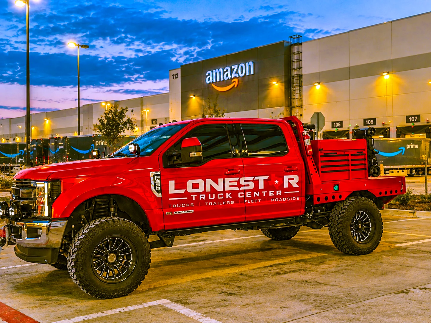 Red Lonestar Truck Center mobile service truck at a commercial fleet facility